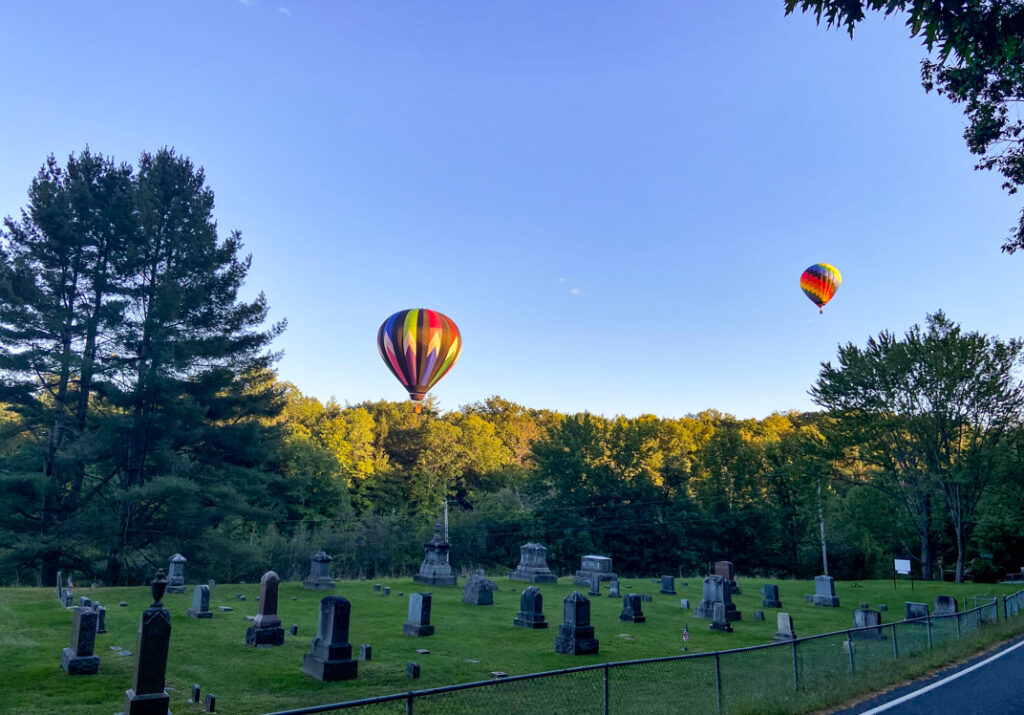 Chasing Hot Air Balloon over Cemetary