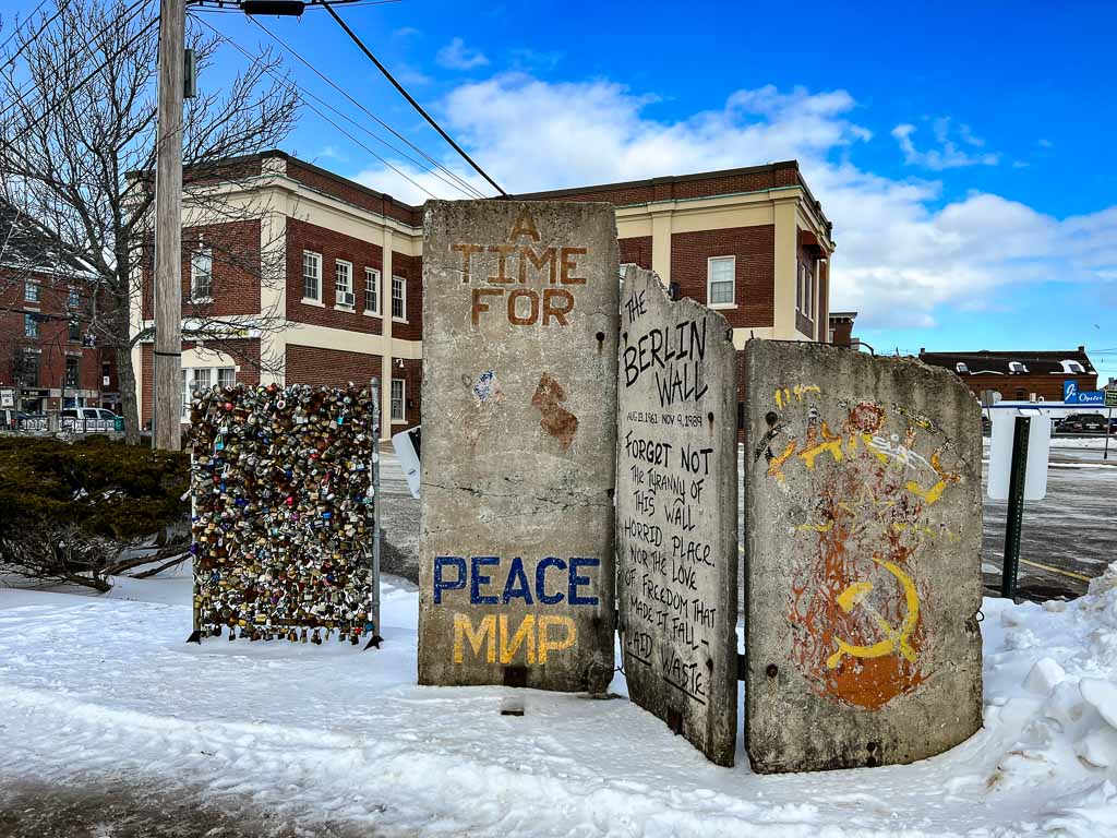 A piece of the Berlin Wall and Love Lock fence