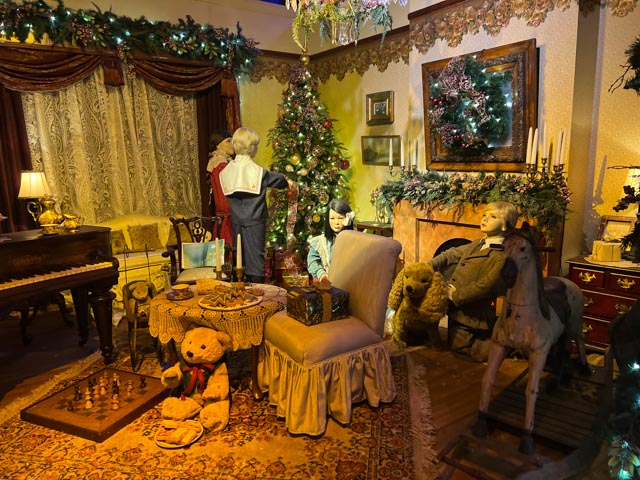 Enchanted Village Scene - Family Decorating Christmas Tree